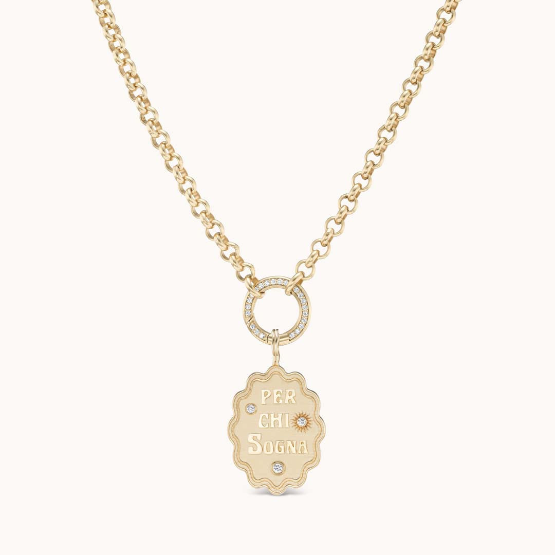 Front of Per Chi Sogna oval charm necklace with gold pendant engraved PER CHI SOGNA and diamond ring on chain