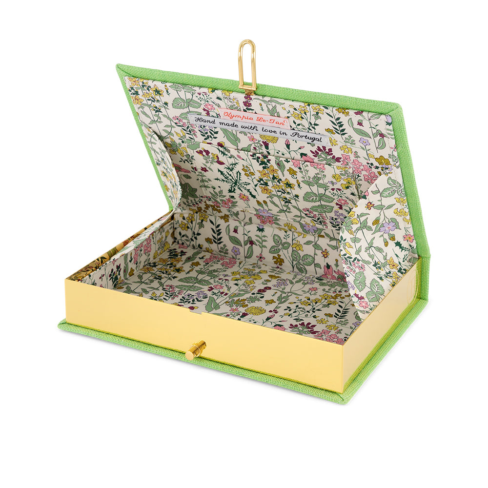 Angled view of Van Gogh Oleanders book clutch showing open floral-lined interior, gold frame and lime green trim