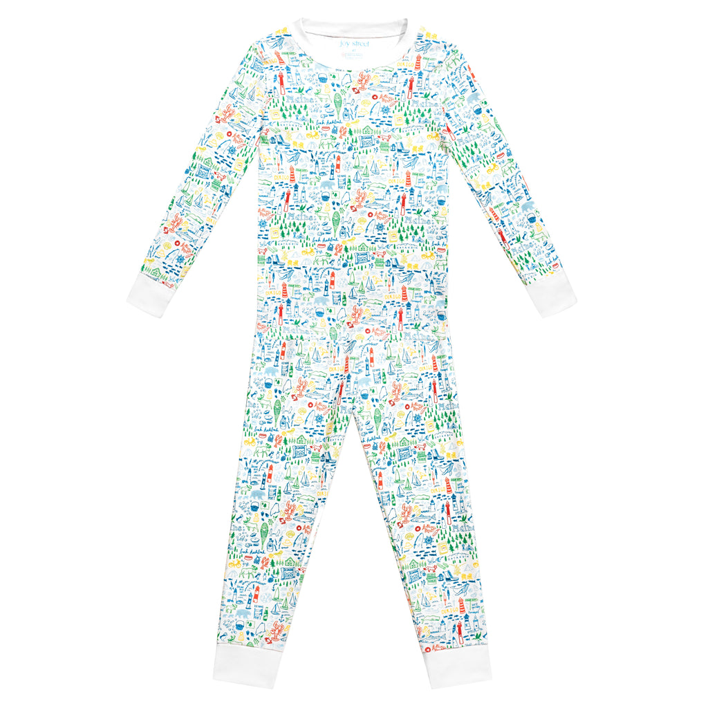 Front view of Maine two piece kids pajamas showcasing a colorful allover print and white cuffs on a white background