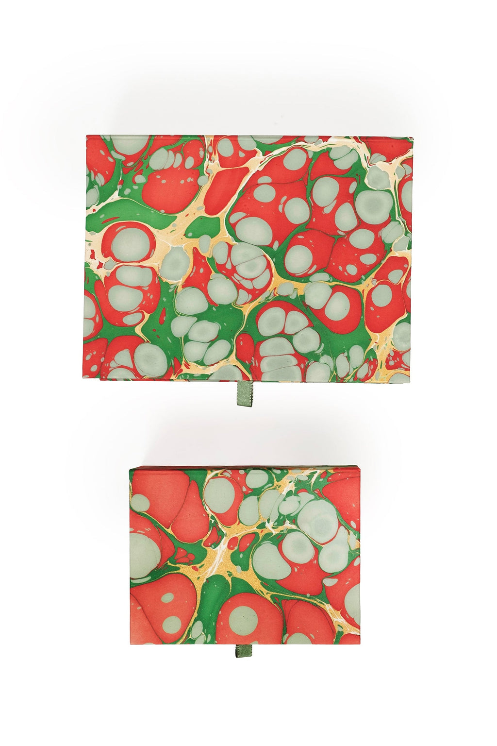 Hand-marbled keepsake box set in Christmas gems pattern with red, green, and white swirls, displaying lids with ribbon pulls.