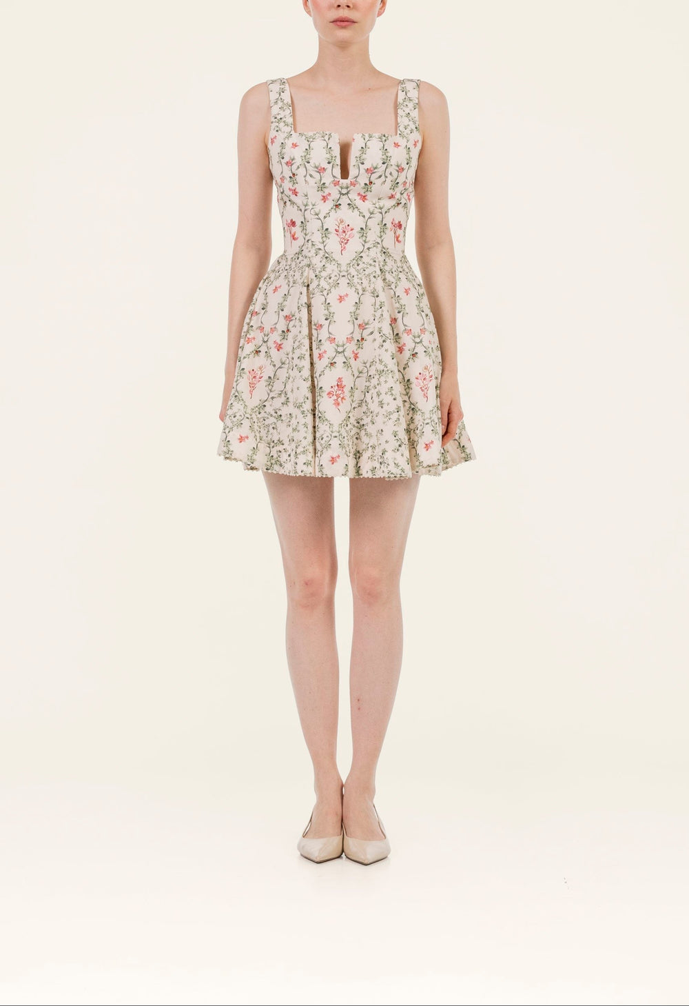 Front view of Agua Cauca Mini Dress showcasing structured sweetheart bodice, wide straps, cinched waist and floral mini skirt