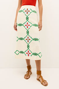 Linen pencil skirt with symmetrical green, red, and blue stitched motifs