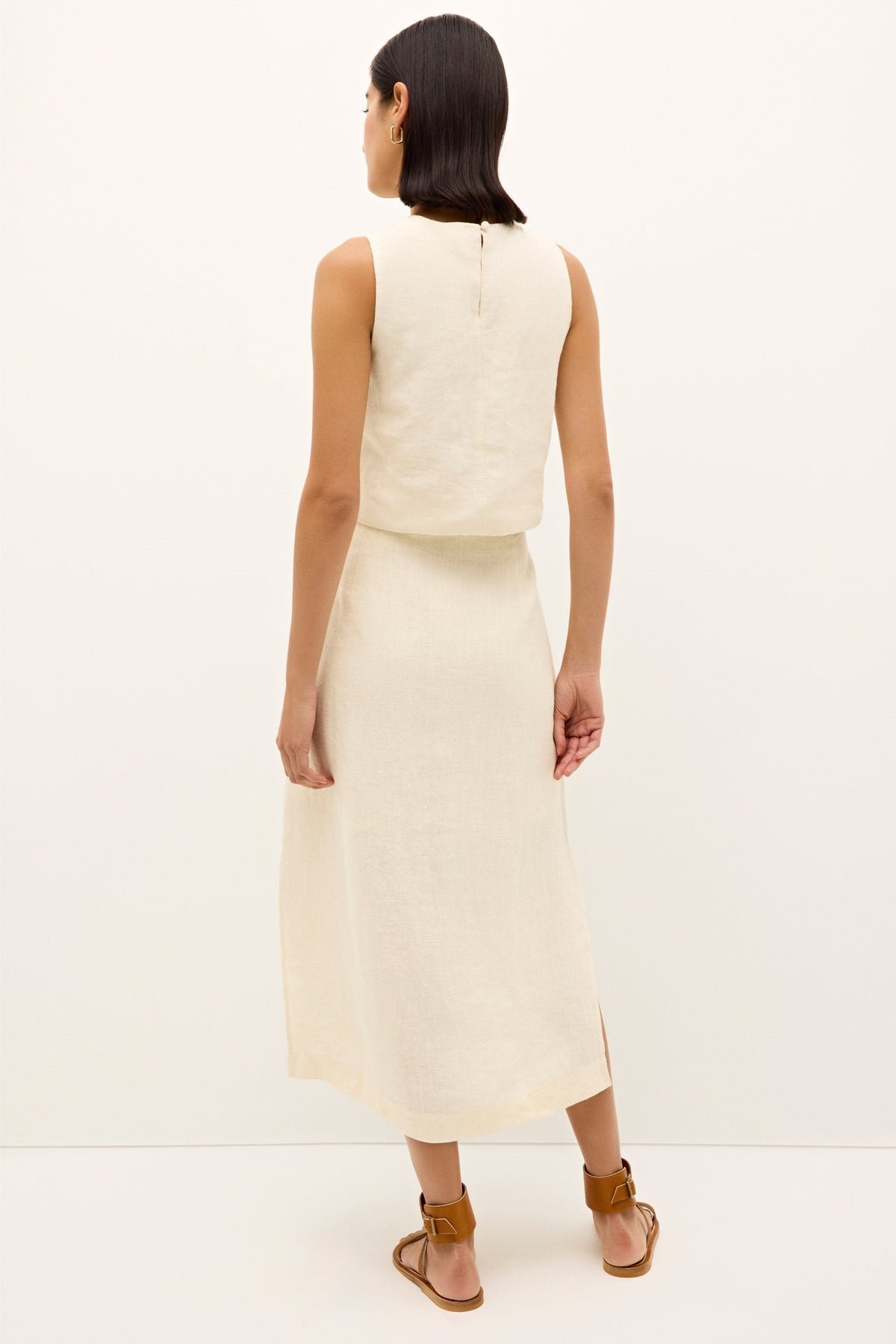 Neutral toned tank top with repeating graphic motifs