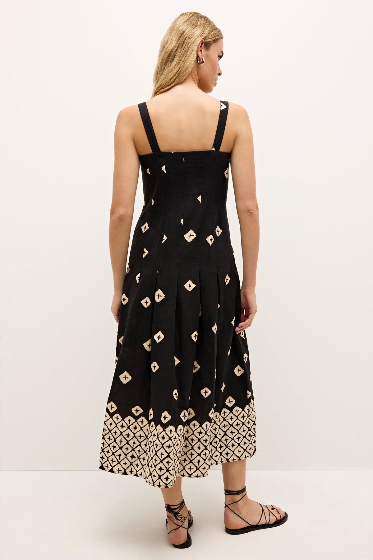 Geometric patterned dress with structured top and flared skirt silhouette  