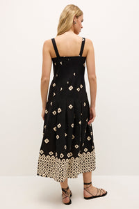 Geometric patterned dress with structured top and flared skirt silhouette  