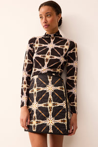 Reversible quilted wrap skirt in a mini length.