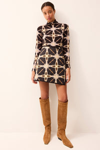 Mini wrap skirt with a reversible pattern and quilted fabric