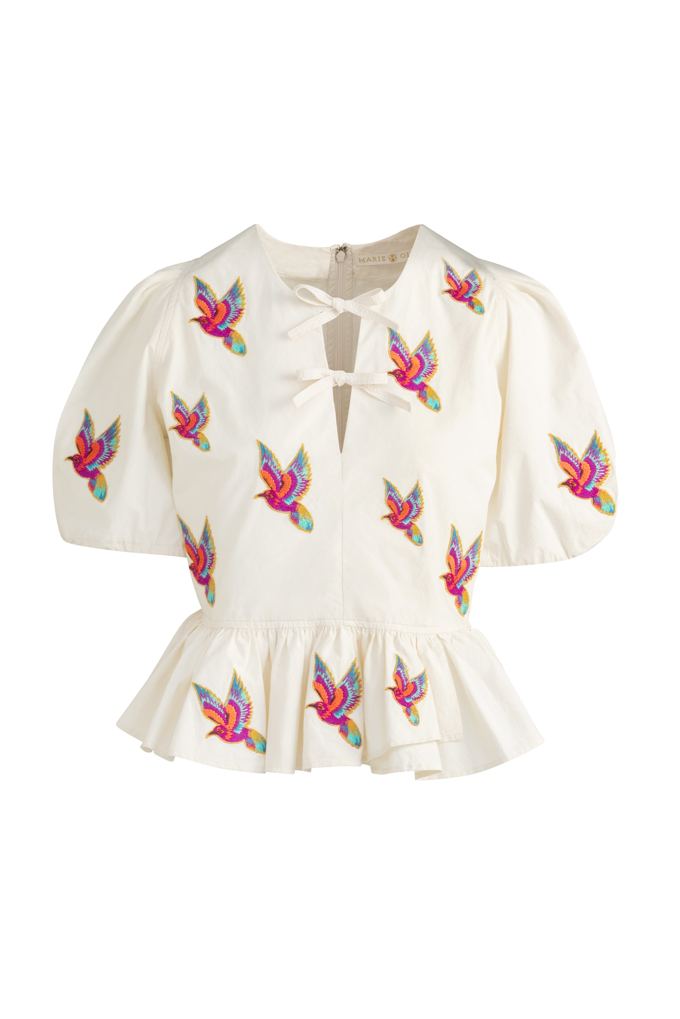 Floral inspired peplum top with voluminous sleeves and tropical design accents 
