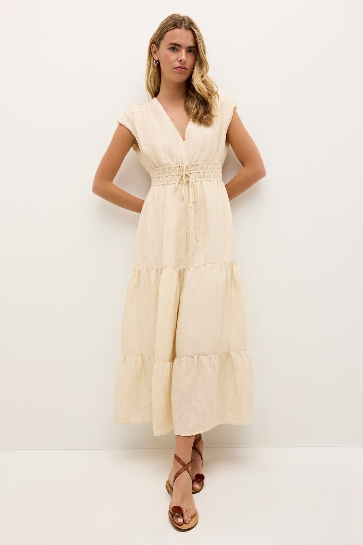 Boho inspired cream midi dress with gathered tiers and a relaxed fit 
