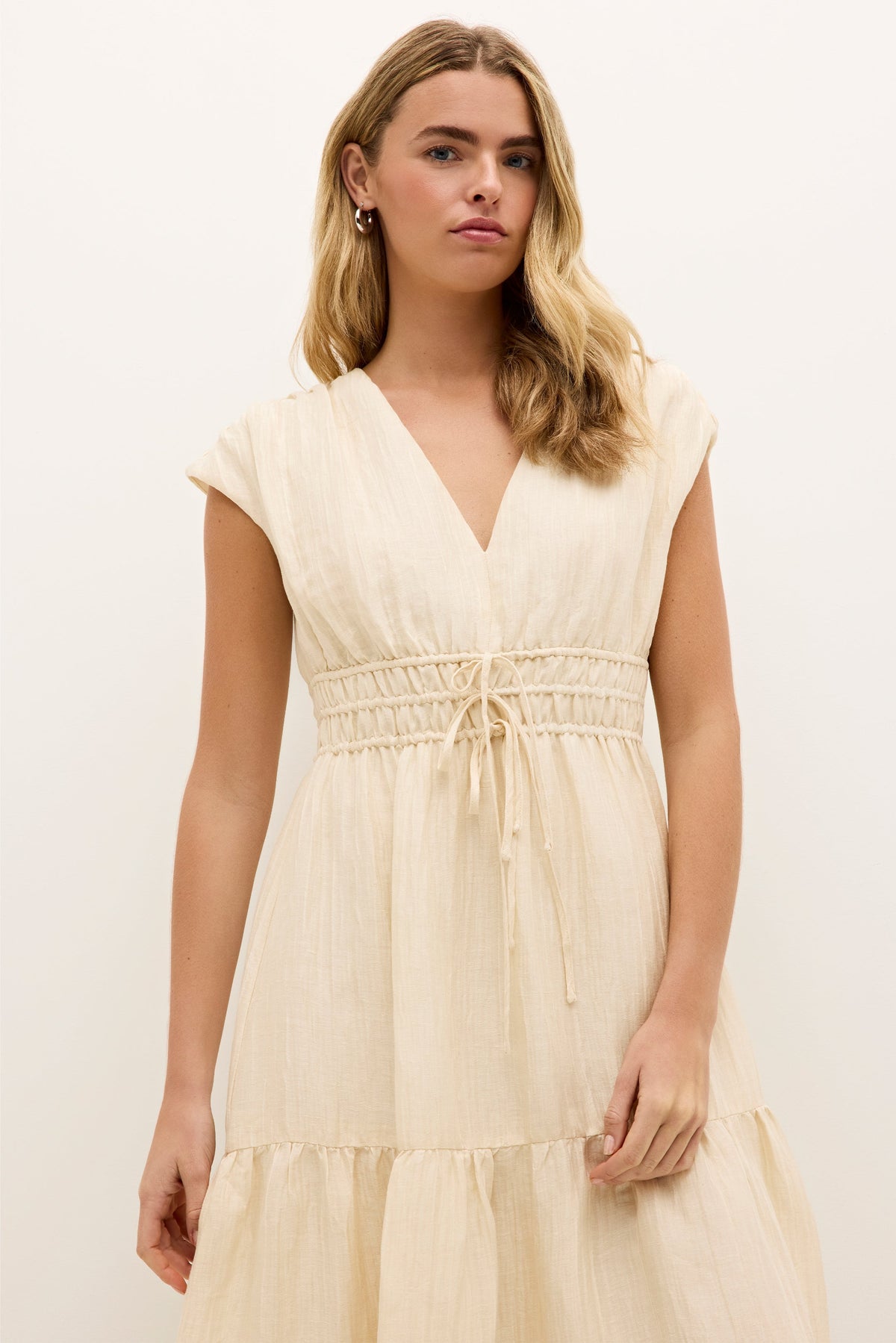 Lightweight V-neck dress in a soft neutral tone with ruched waist detail 