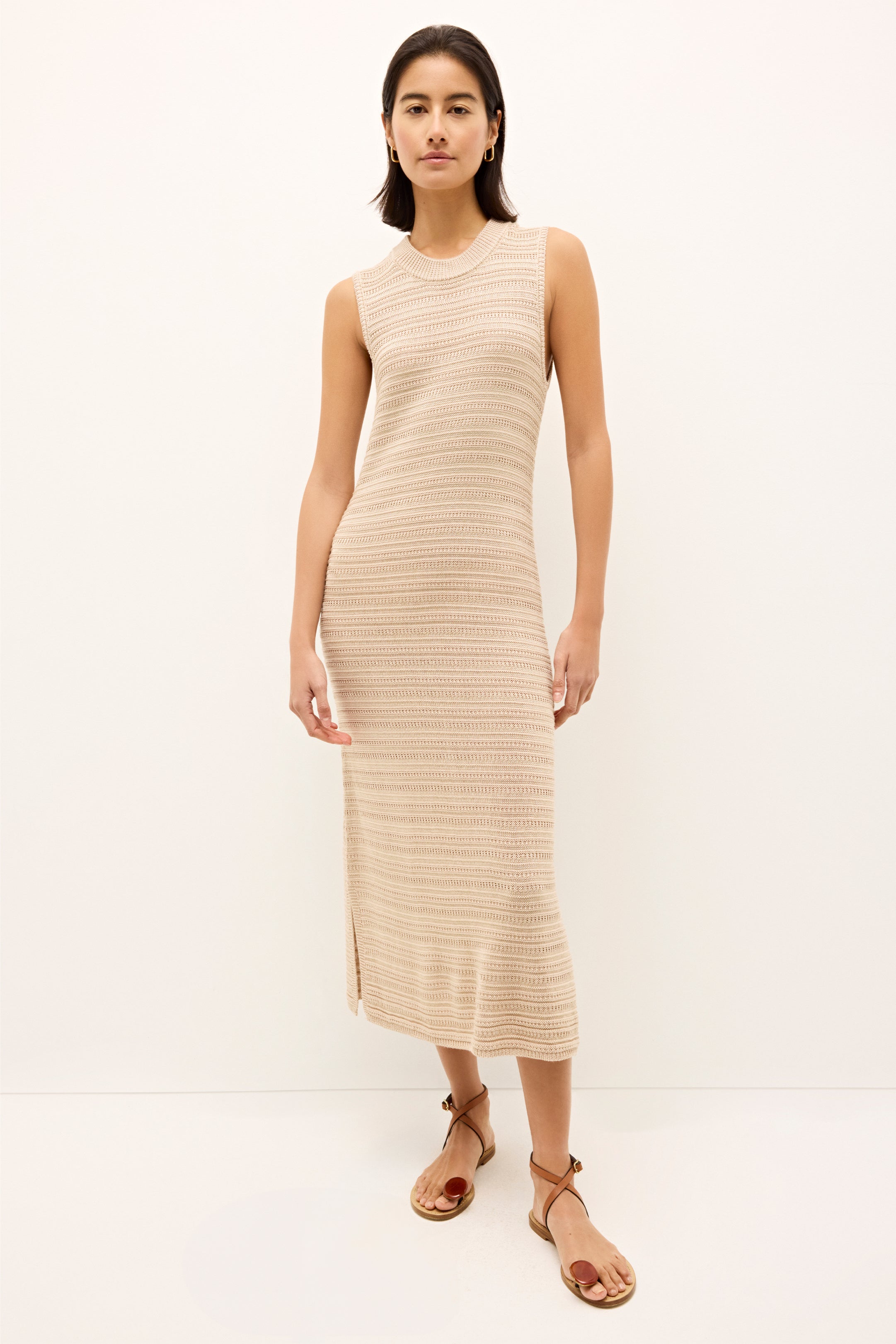 Sleeveless midi dress in neutral beige with subtle horizontal stripe texture 