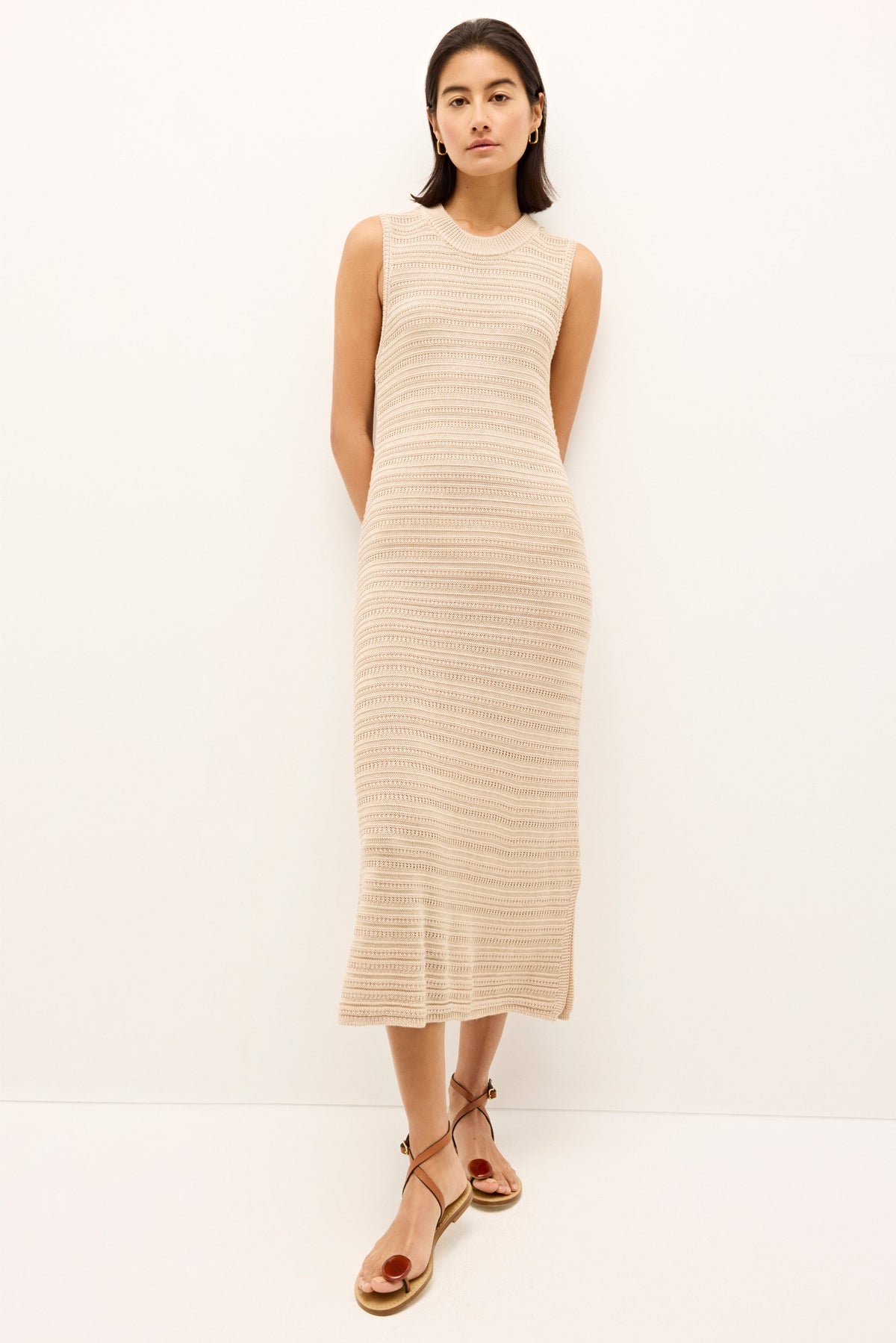 Beige ribbed dress with a straight silhouette and side slit detail 