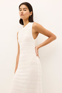 minimalist white sheath dress with a round neckline and ribbed horizontal detailing
