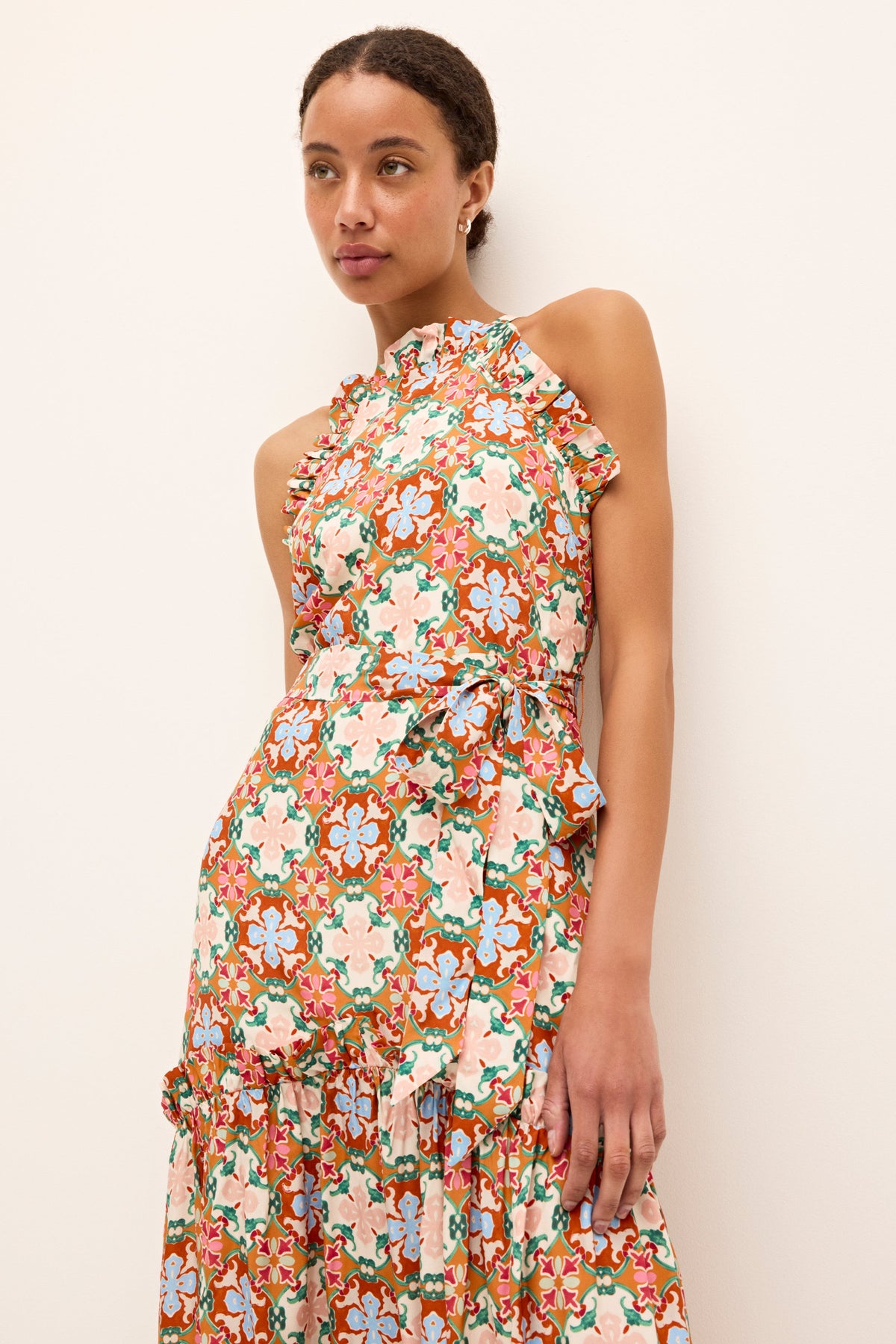 Tiered full length dress with fitted bodice and colorful graphics