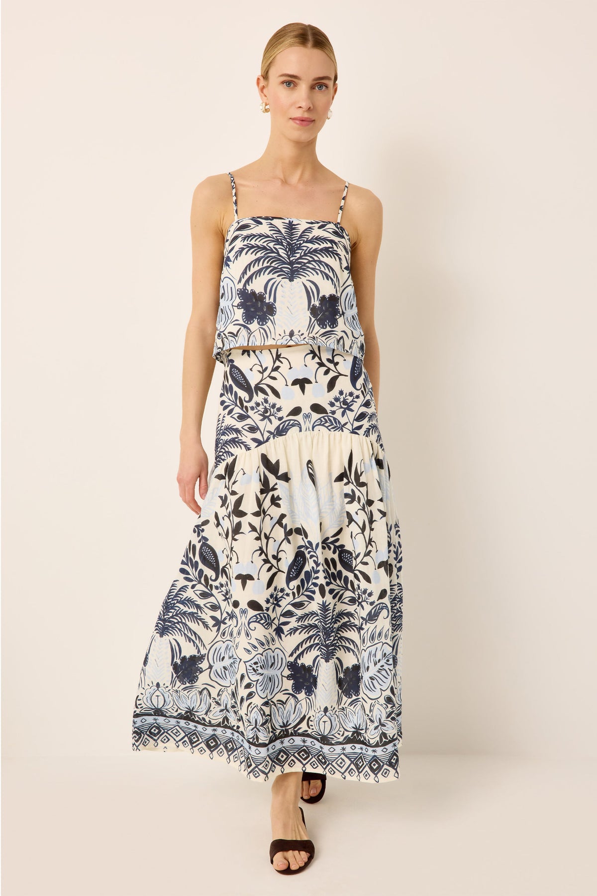 Sleeveless blue and white tropical printed cropped top with a matching drop waist midi skirt