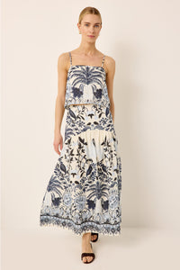 Sleeveless blue and white tropical printed cropped top with a matching drop waist midi skirt