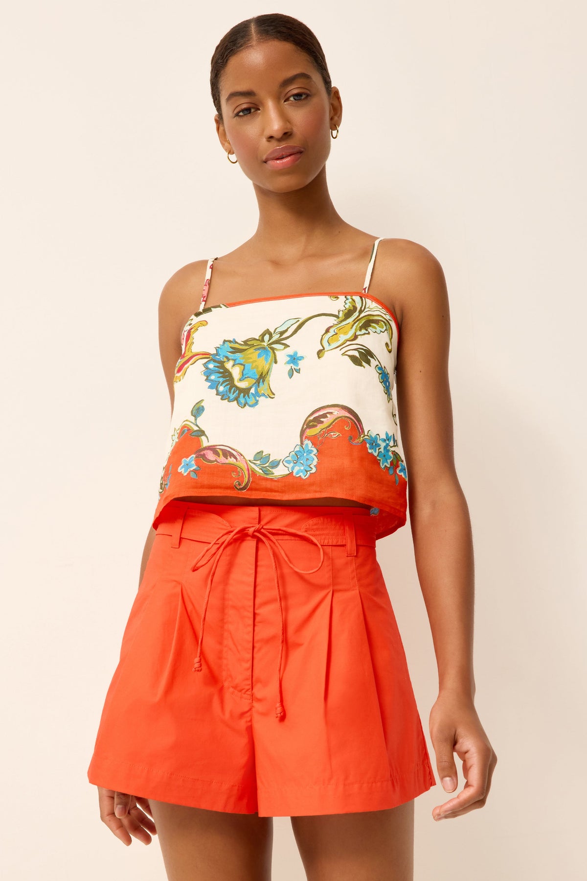 Front view of Lander Short in Grenadine on model, showing high waist, pleated front, corded tie belt, and wide leg
