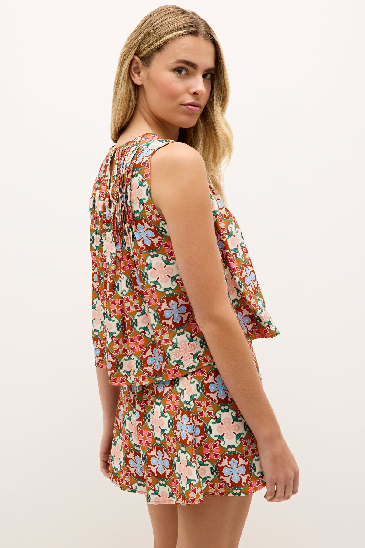Colorful sleeveless tank with a loose, airy shape and pleated accents