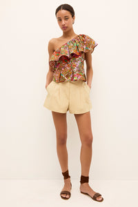 Colorful asymmetrical blouse with geometric patterns and a flounce detail