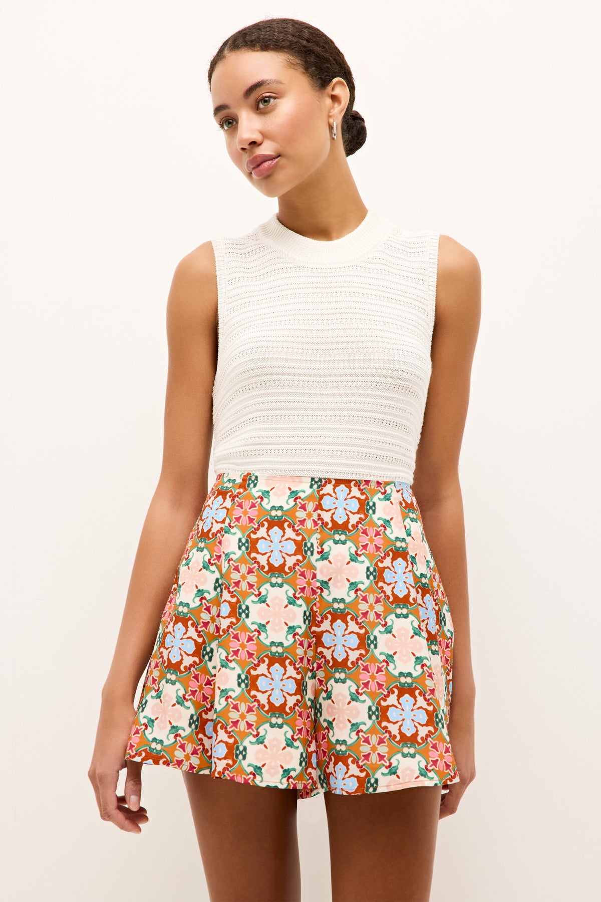 Colorful printed shorts with a kaleidoscopic floral tile design