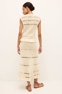Ivory sleeveless top with handcrafted crocheted design and ornamental hem