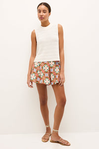 Cream colored sleeveless top with horizontal stitch detailing and a fitted silhouette