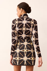 Fitted long-sleeve mock neck top featuring an allover pattern.