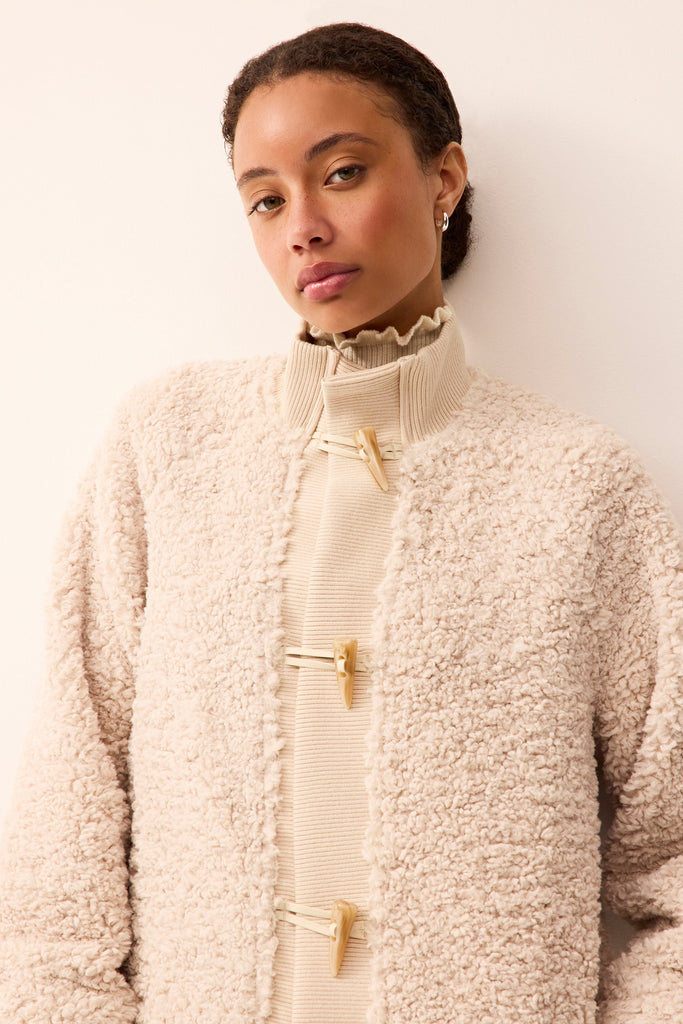 Elevated sherpa jacket in an off-white neutral