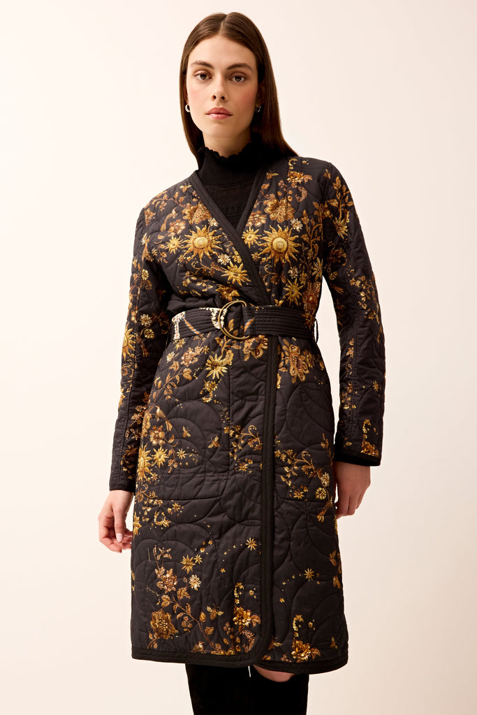 Belted quilted jacket with long sleeves and reversible design 