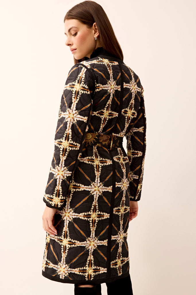 Long-sleeve quilted coat with a reversible style and matching belt.