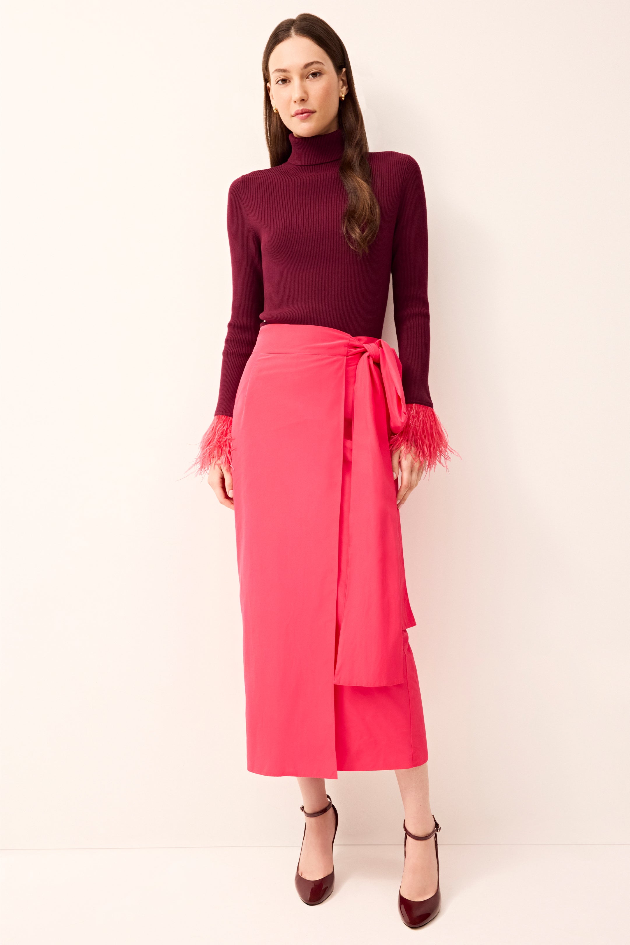 Bright pink wrap midi skirt with a big bow on the waist 