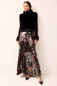 Maxi skirt with disc sequins reflecting a black and red tint