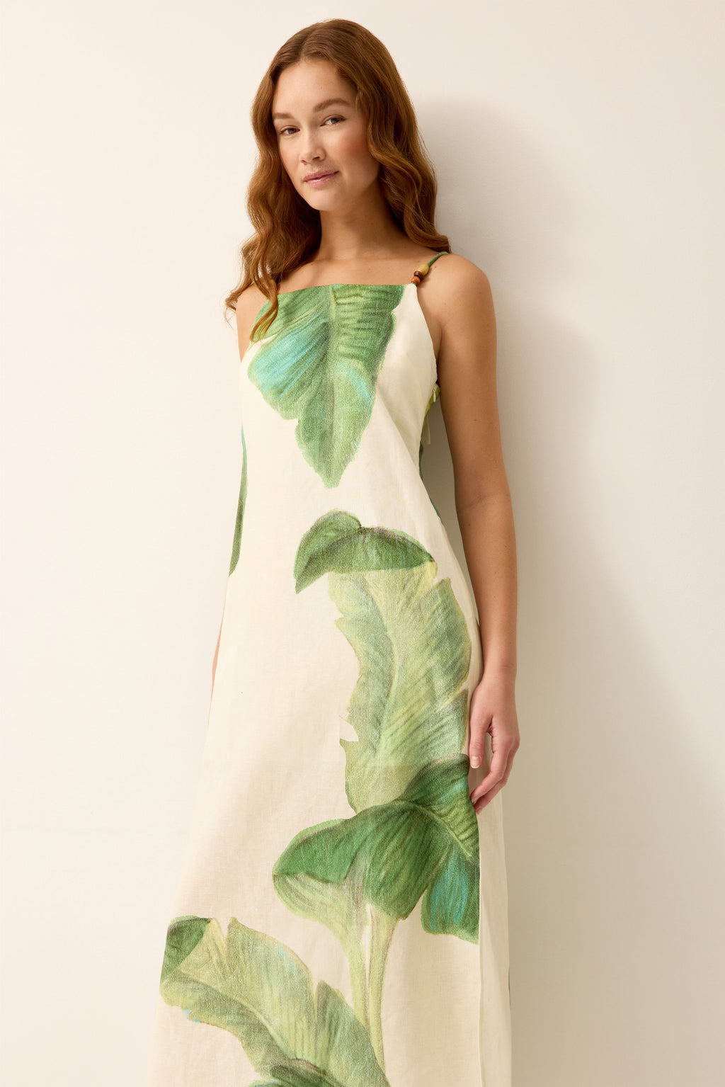 Sleeveless green and white palm leaf midi dress