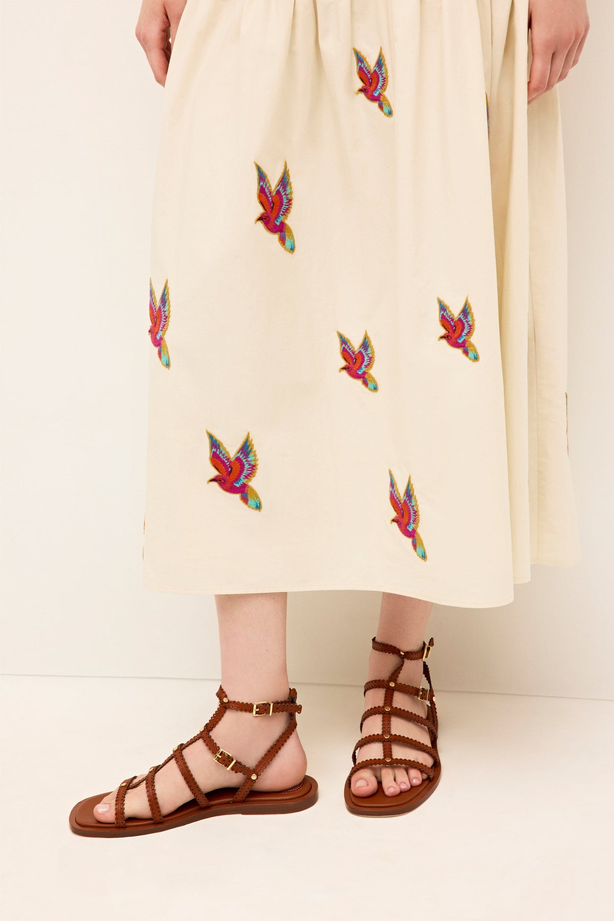 High waisted flared skirt with vibrant bird embroidery on cotton fabric 