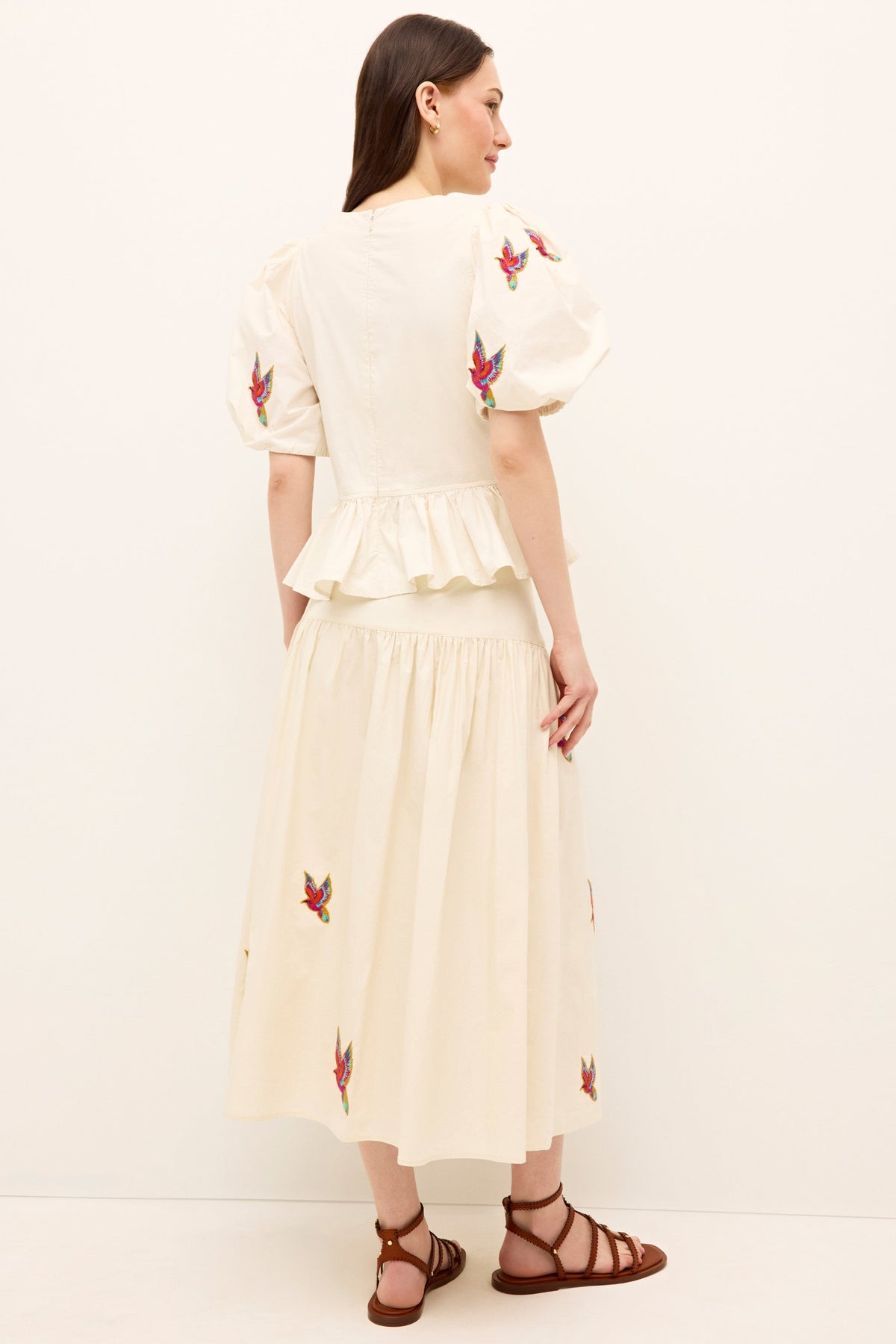 Lightweight white skirt with a full silhouette and tropical bird design 