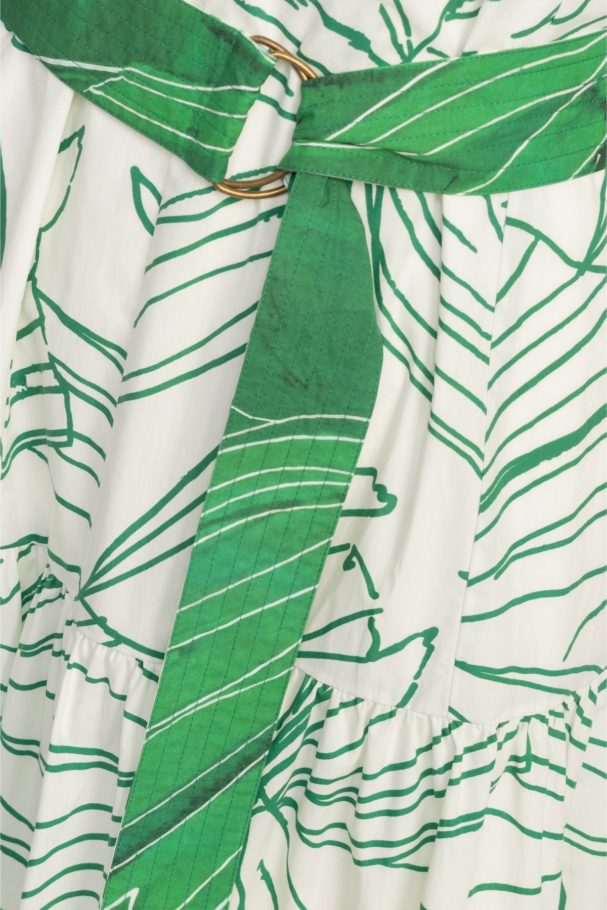 Green on white leaf print dress with a cinched waist and relaxed waist