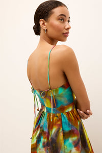 Colorful scrappy dress with an empire waist and breezy, ankle length hemline 