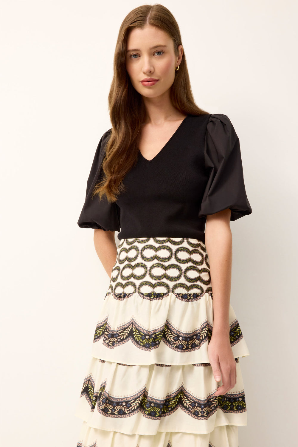 Front view of Shayna Top in Black on model showcasing fitted rib-knit bodice, V-neck, and cotton poplin puff sleeves