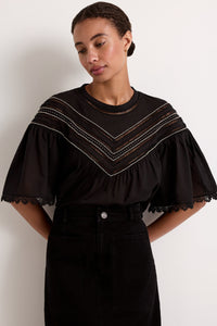 Front view of Tatiana Top in Caviar with intricate yoke trim and batwing sleeves on a model against a neutral background