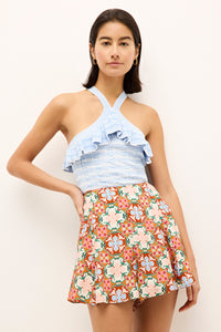 Sleeveless textured knit top in soft blue with flounce detail