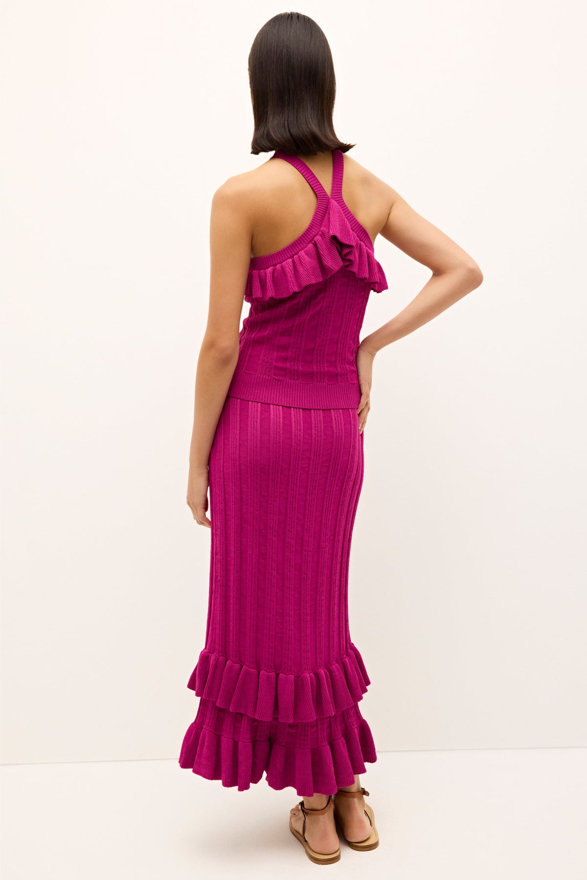 Vibrant magenta top with textured knit design and romantic ruffled neckline 