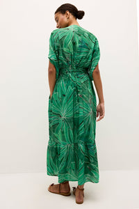 Green dress with white palm motifs and flowy silhouette