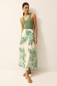 Green knit tank top with a full coverage back with a green and white floral printed midi skirt