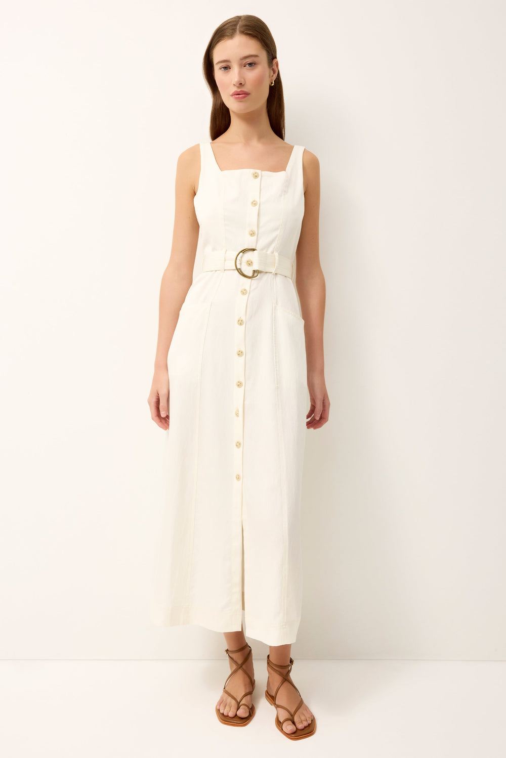 Front view of Whitner Dress in ivory on model showcasing square neckline, button-front, D-ring belt, front pockets, A-line midi
