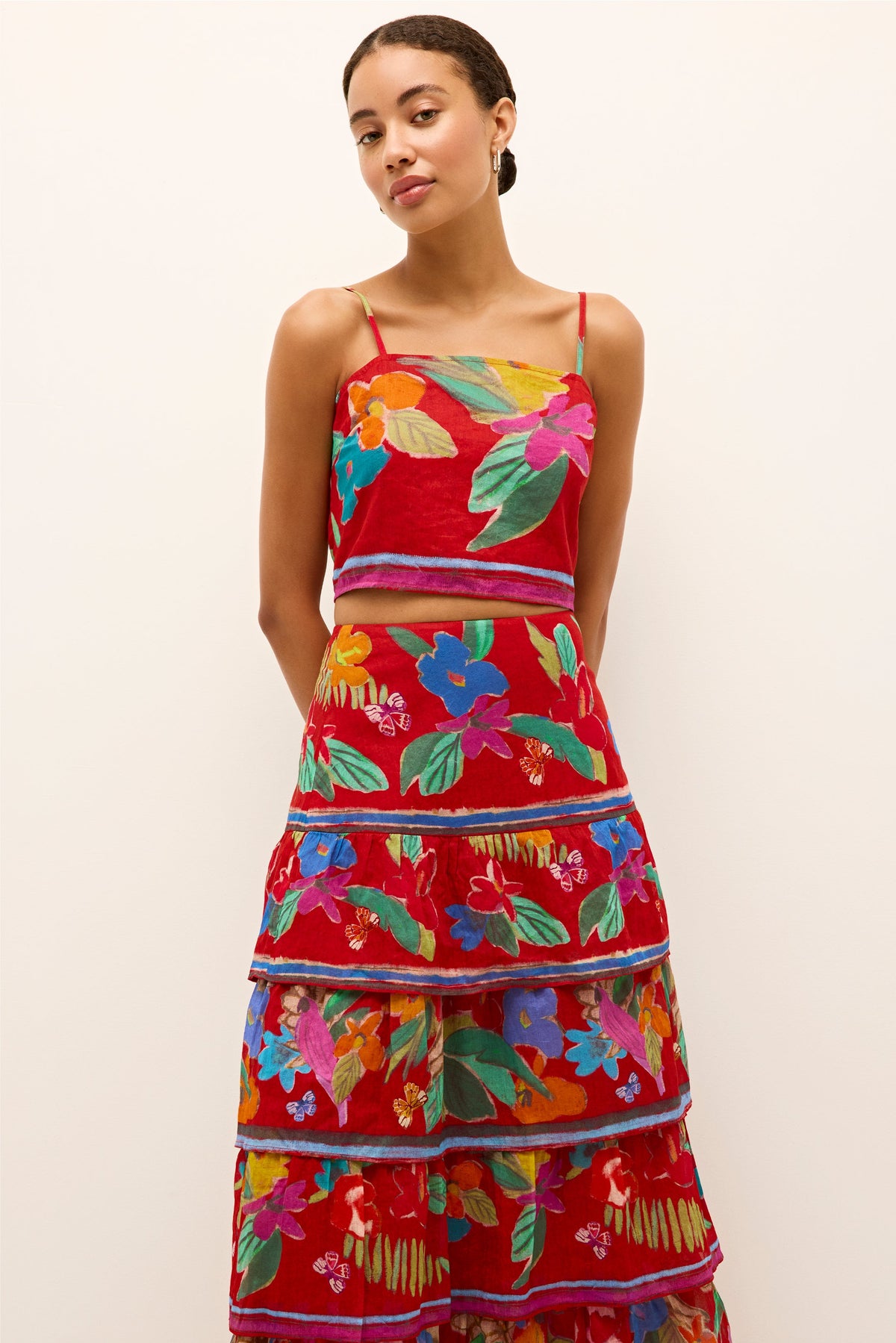 Tropical inspired red top with bright florals and contrast trim detail 
