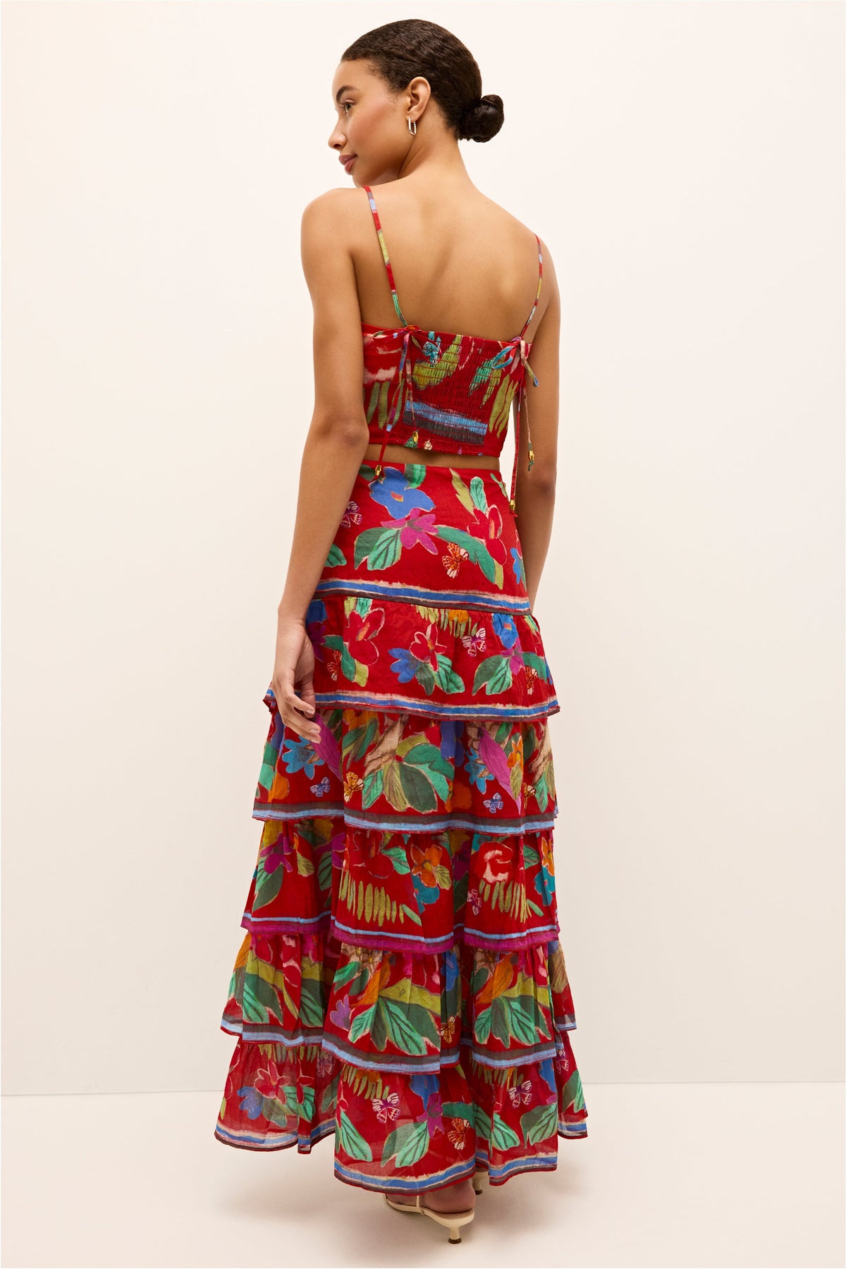 Printed tank style top with colorful foliage on a red background 