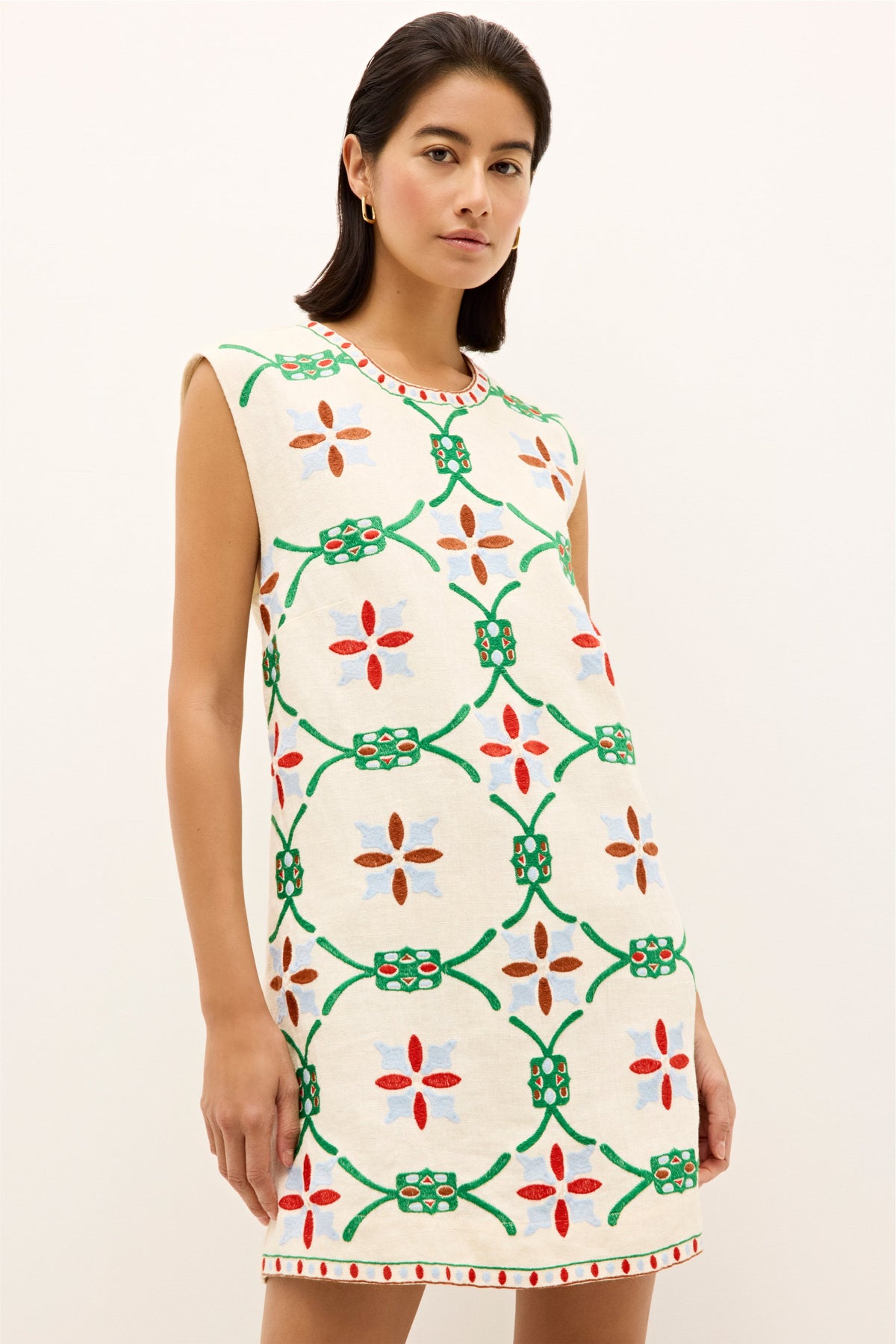 Embroidered cream dress with bold garden inspired pattern and crew neckline