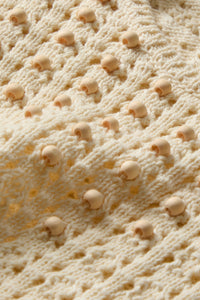 Slightly cropped ivory knitted tank with beading and fringe