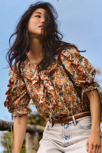 The Marigold Top in Gertrude paired with the Wray Pant in washed blue denim. 