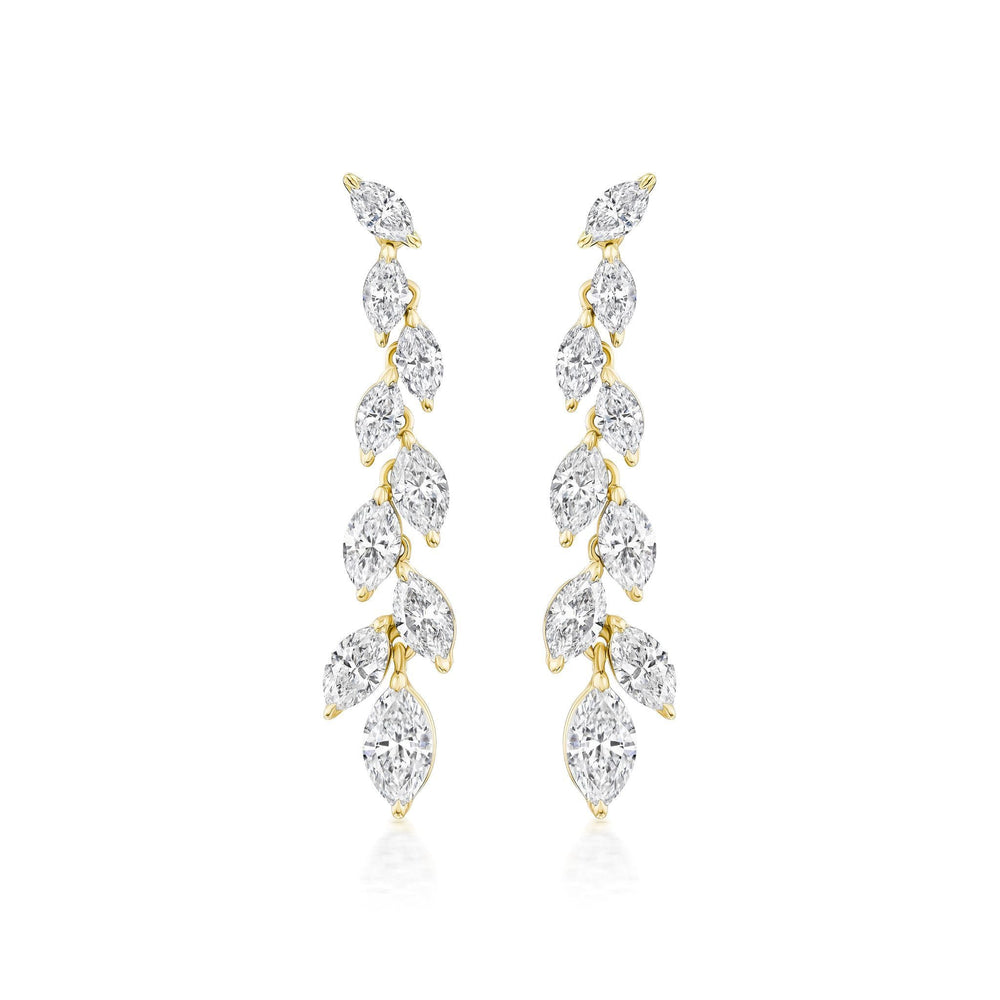 The Marquise Diamond Waterfall Drop Earrings showcase a vertical row of marquise cut diamonds in a leafy, vine-inspired gold design for a delicate, sparkling look.